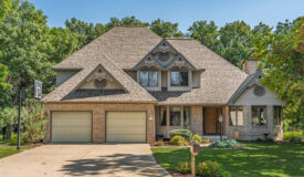 1.5-story brick home on a spacious .58-acre lot in Portage