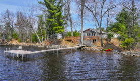 Turnkey Lake Petenwell Waterfront Cottage | Owned Shoreline, Pier & Sunset Views in Arkdale, WI